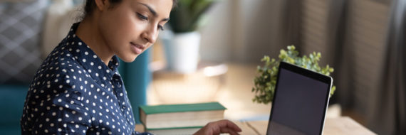 A woman studies for the ABPTS exams