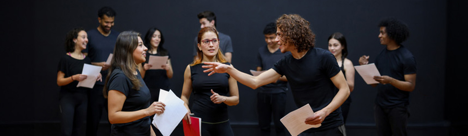 People practicing improv comedy, demonstrating the "Yes And" technique to improve patient communication in healthcare.