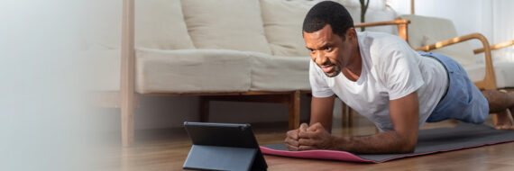 Healthcare provider using a digital device to enhance patient engagement during a consultation.